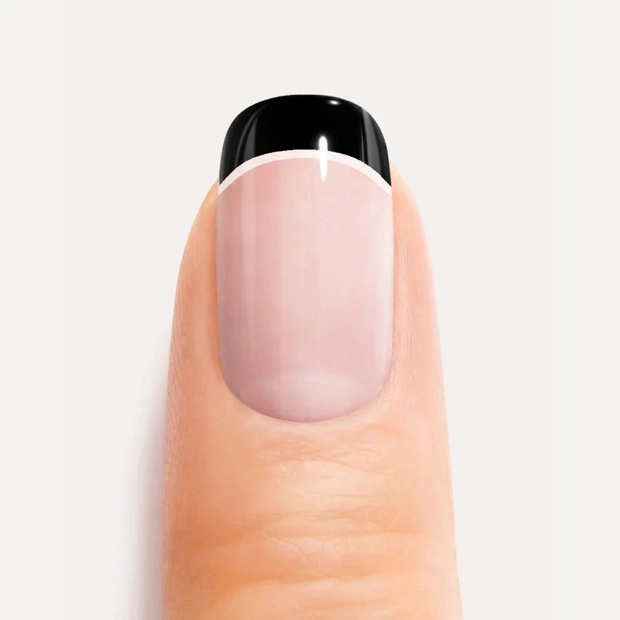 Black and white french gel nail strips closeup